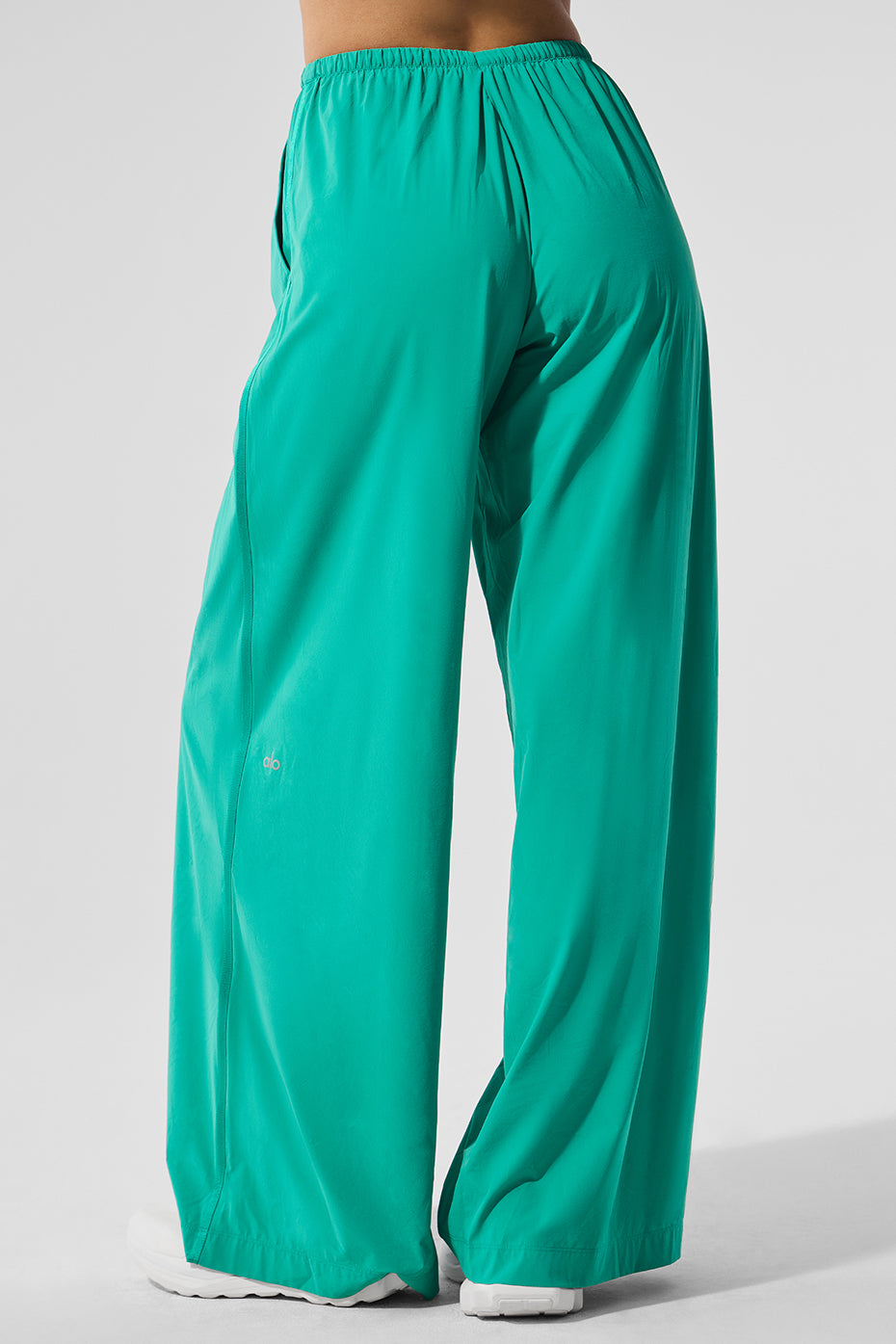 Front view of spruce green wide leg yoga pants on a model.