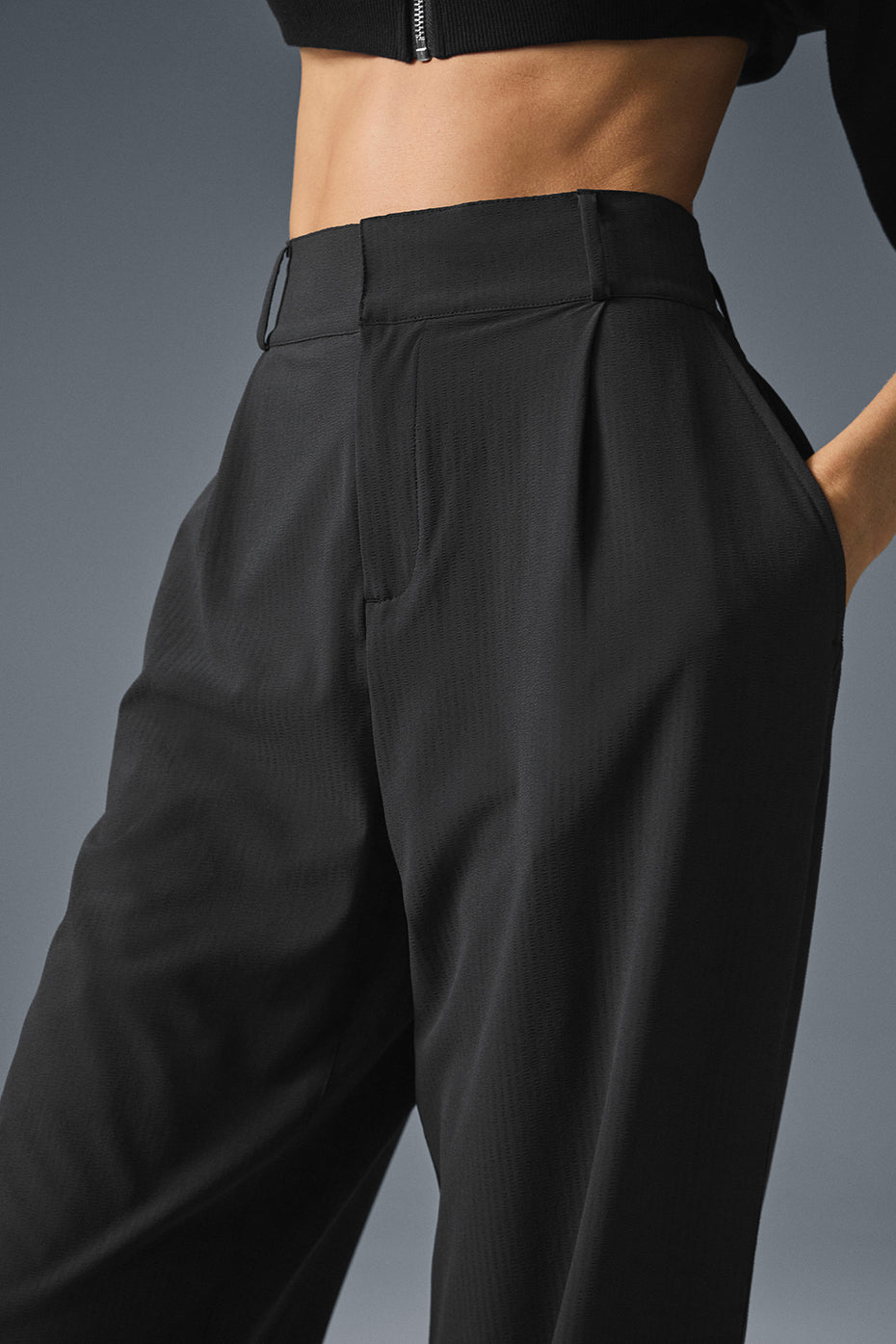 Close-up of breathable crinkle fabric pants detailing and pleated fold.