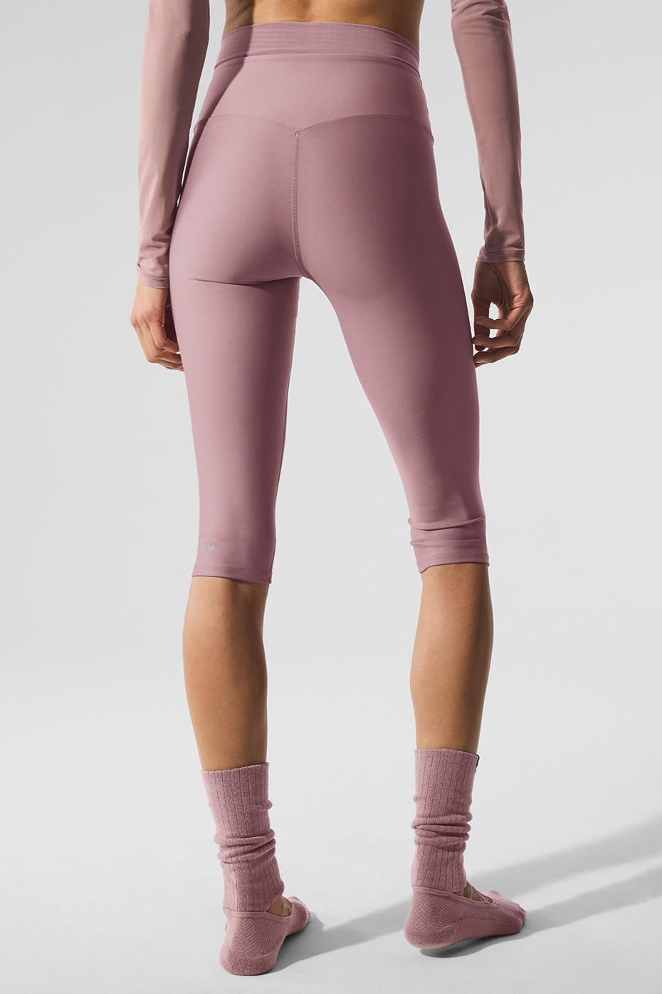 Front view of Airlift high waisted capris showing adjustable waistband.