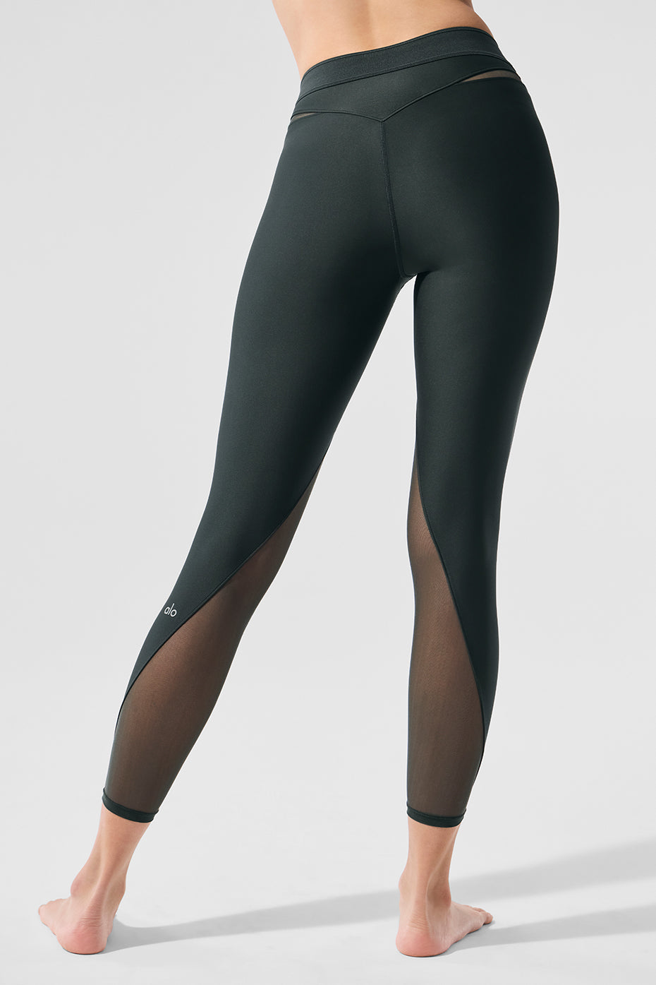Front view of Airlift high-waist leggings with mesh panels in charcoal green.