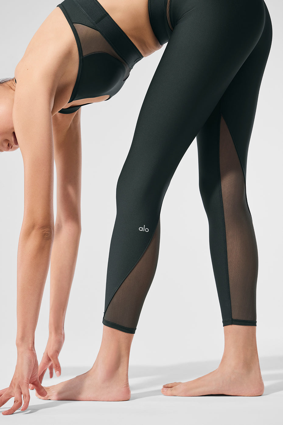 Side view showcasing the stylish mesh panels on the Airlift leggings.
