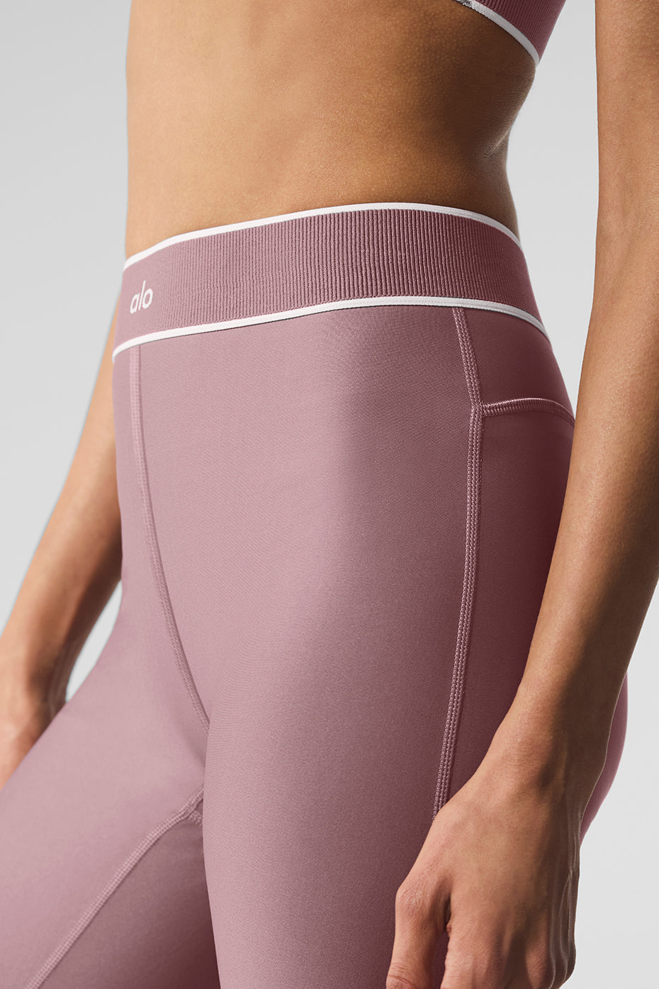 Model wearing compression leggings for legs during yoga session