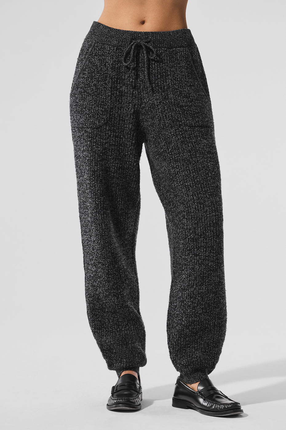 Close-up of drawstring waistband and marl knit texture on sweater pants