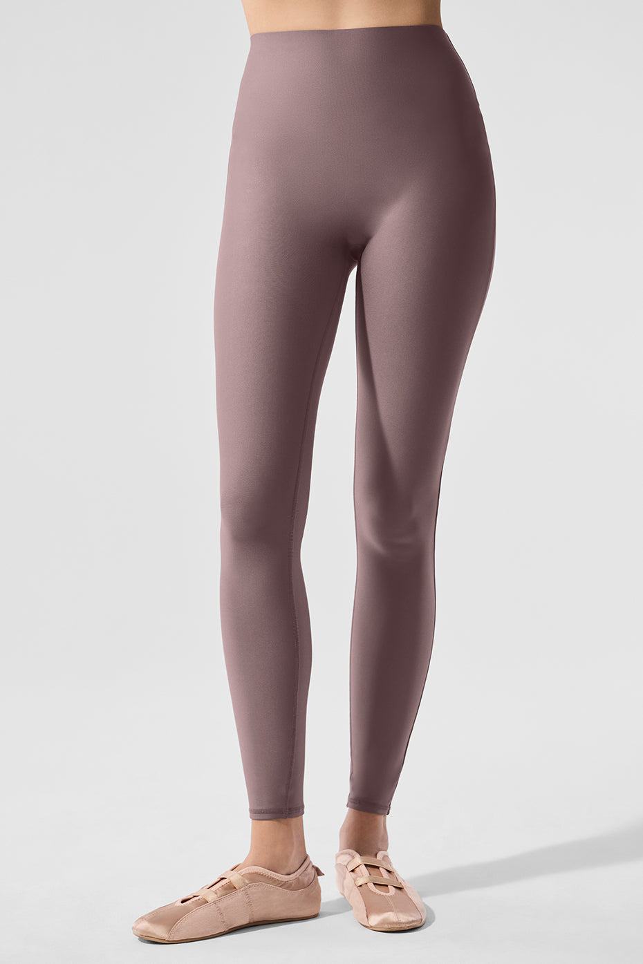 Close-up of Alo Airlift leggings' seamless waistband on athletic build