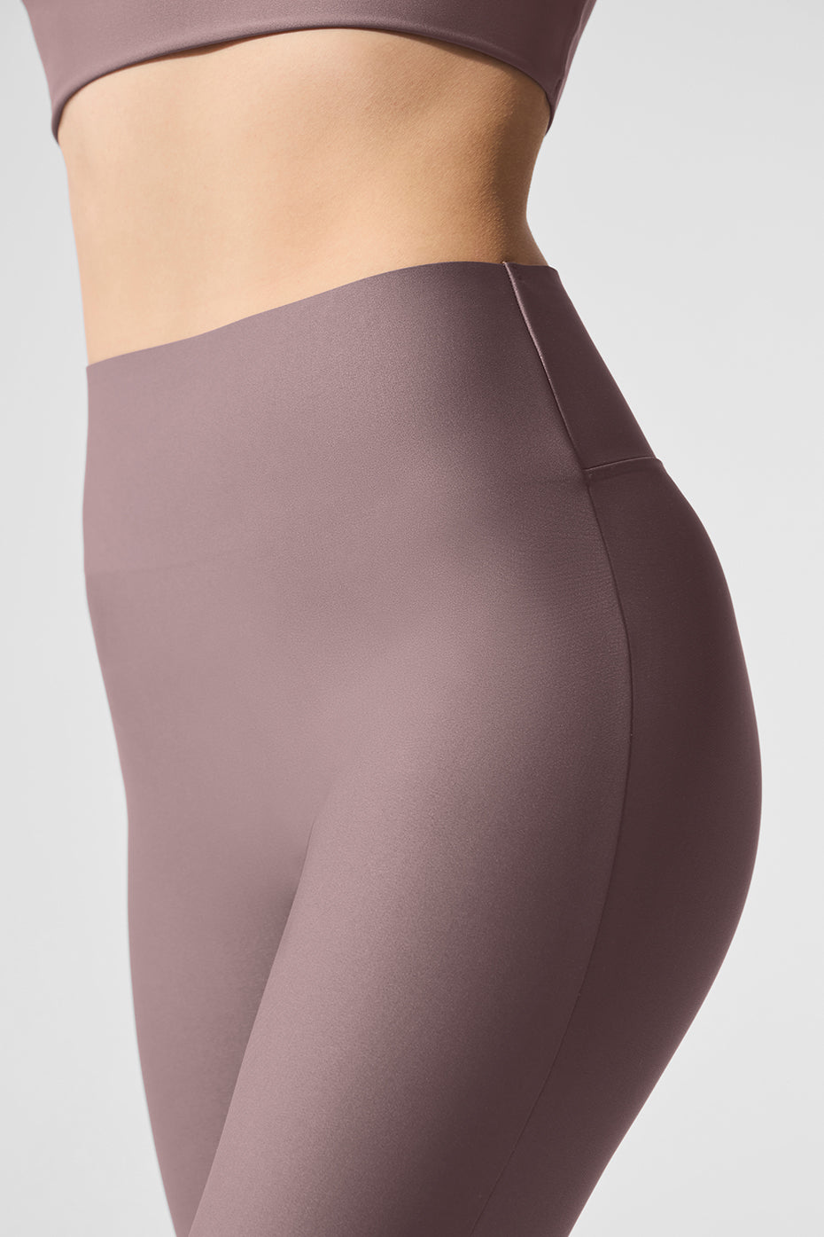 Close-up of Alo Airlift leggings seamless waistband on athletic build