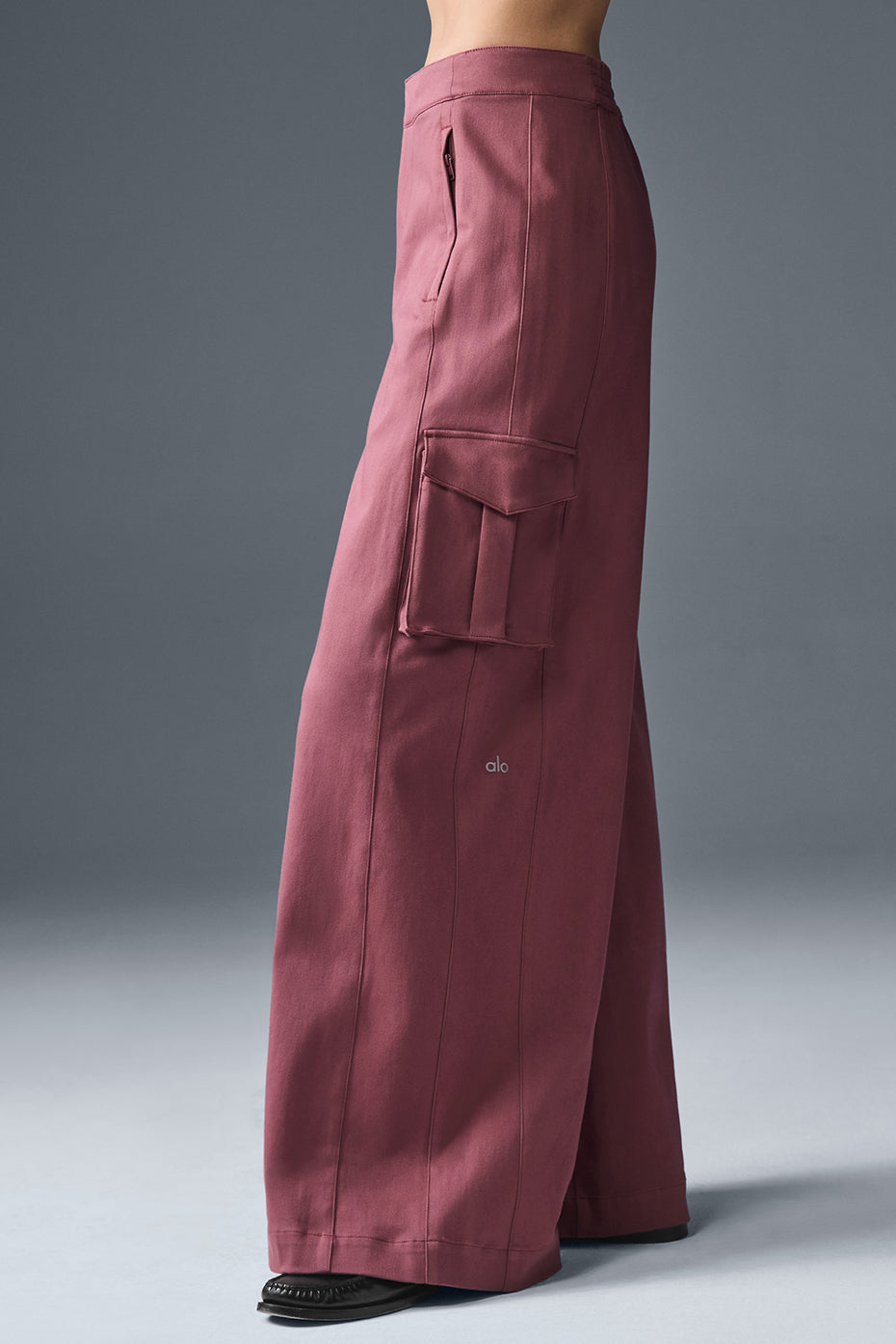 Side profile of wide leg trousers demonstrating drape