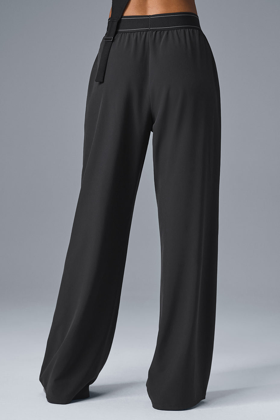 Black straight-leg trousers styled with blazer for office wear