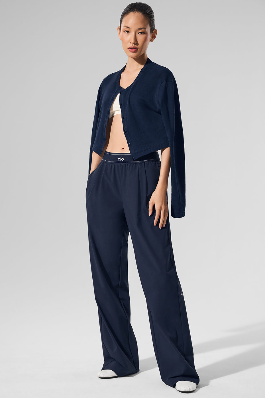 Close-up of the elastic waistband on mens trousers navy for a tailored look.