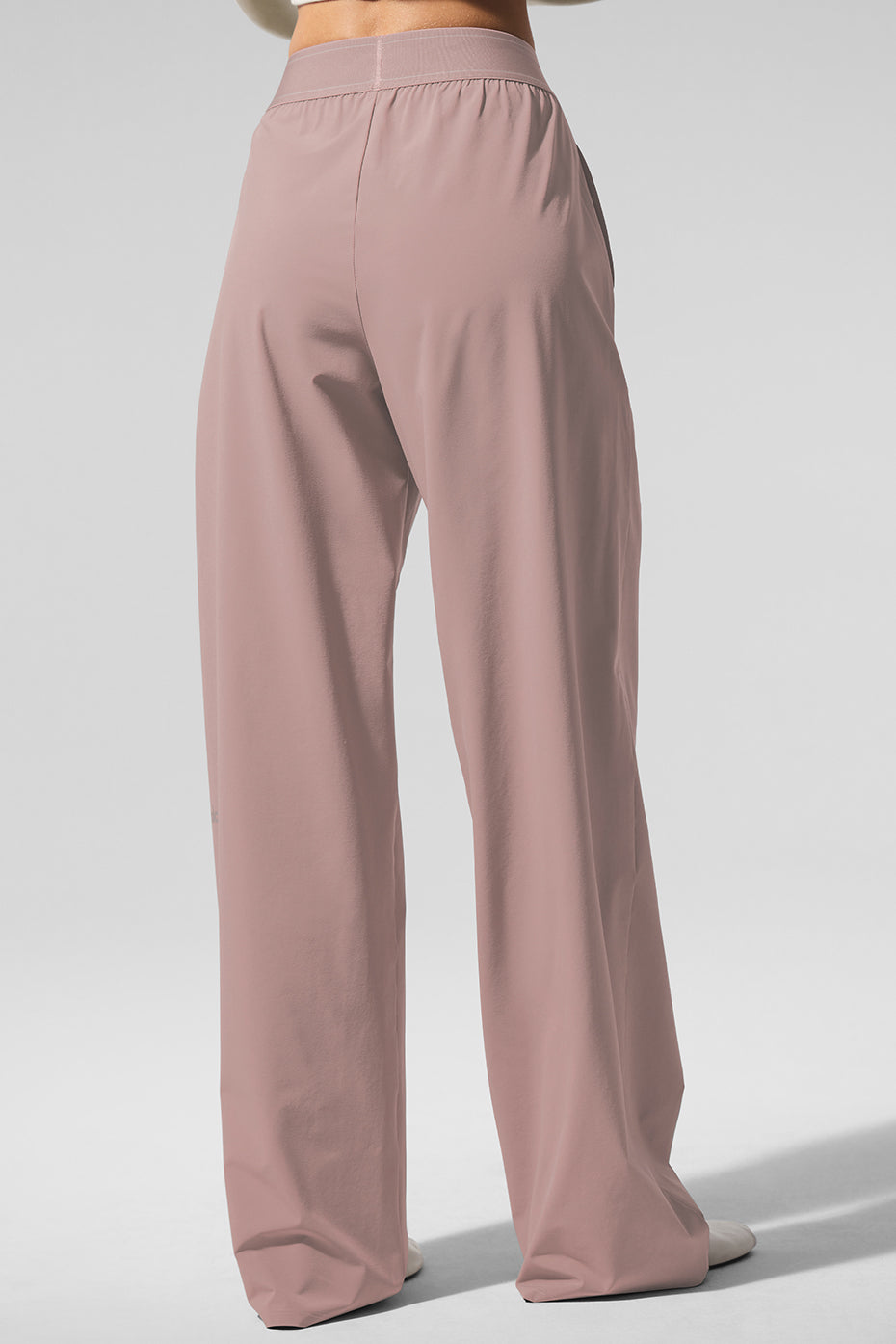 Close-up of lightweight, softly swishy fabric of womens dress pants
