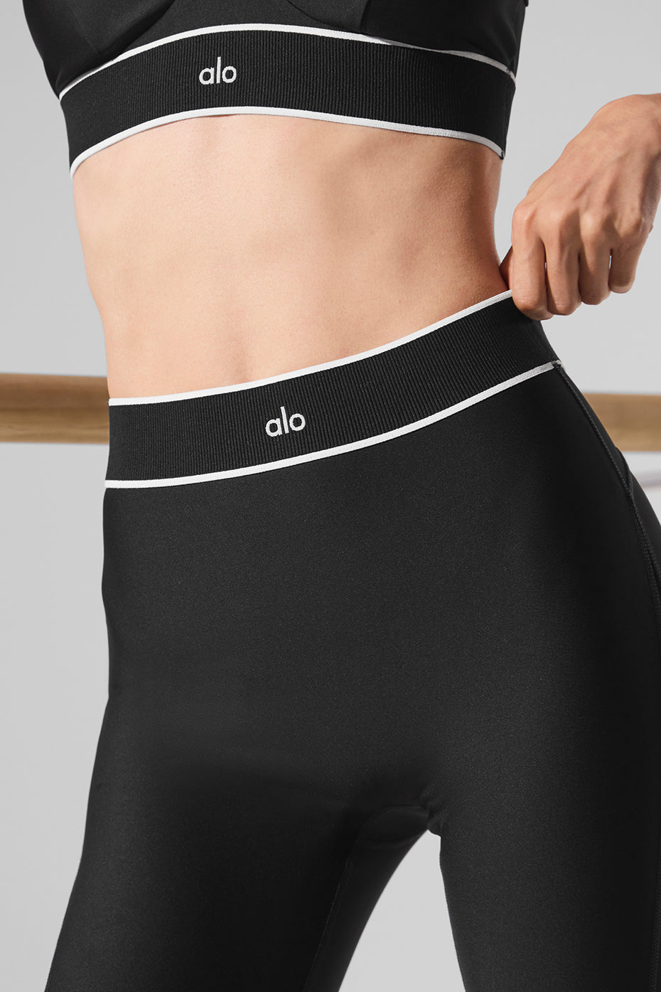 Rear view showing sculpting seams and stirrup hem design