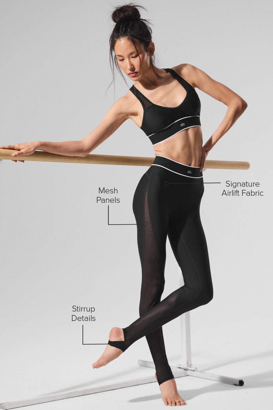 Woman wearing leggings in a dynamic stretch pose, urban backdrop