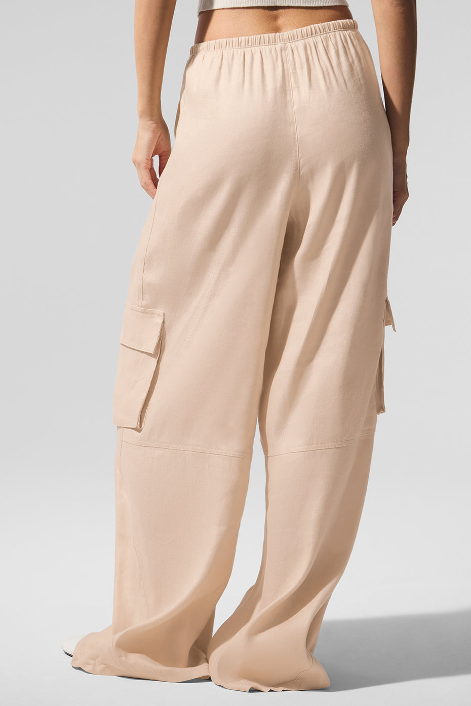 Macadamia linen cargo pants laid flat to show wide leg silhouette