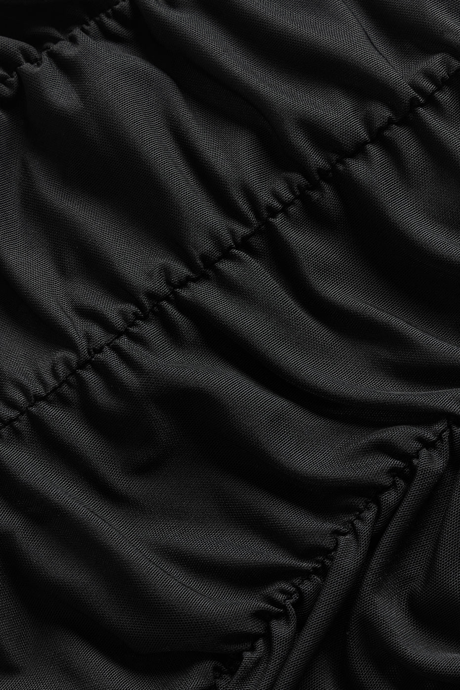 Side view showcasing the flared leg of the high waisted leggings.