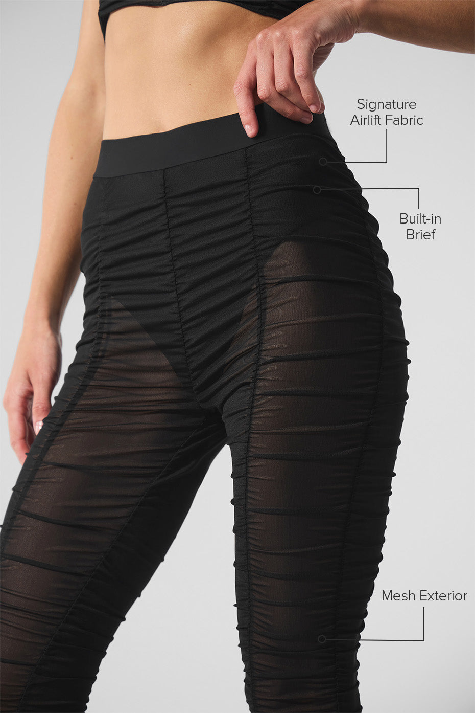 Side view showcasing the flared leg of the high waisted leggings.
