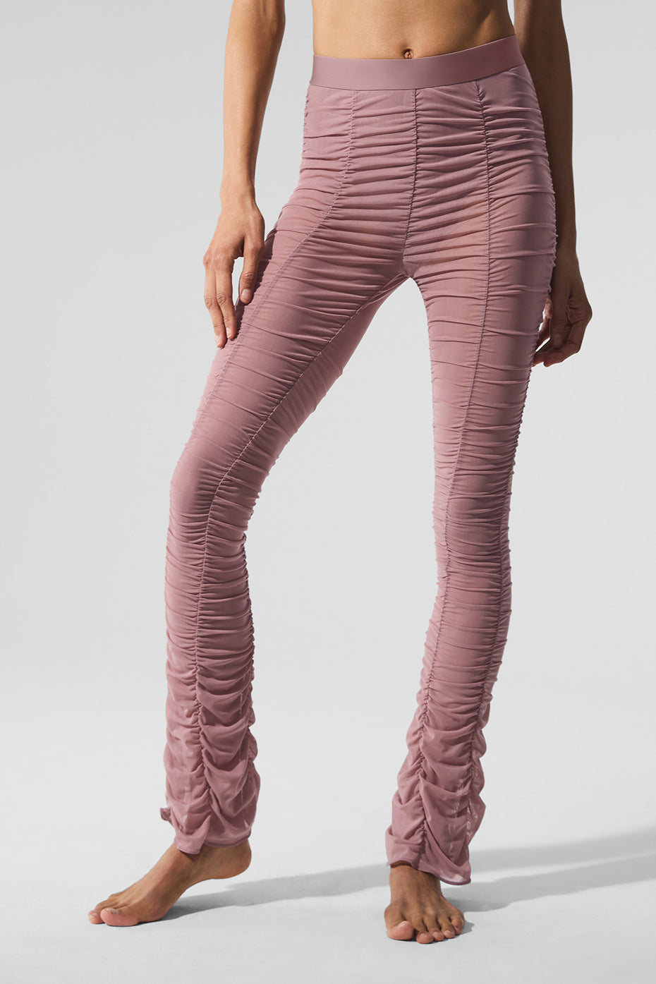 Close-up of mesh fabric on high-waisted leggings highlighting the built-in brief.