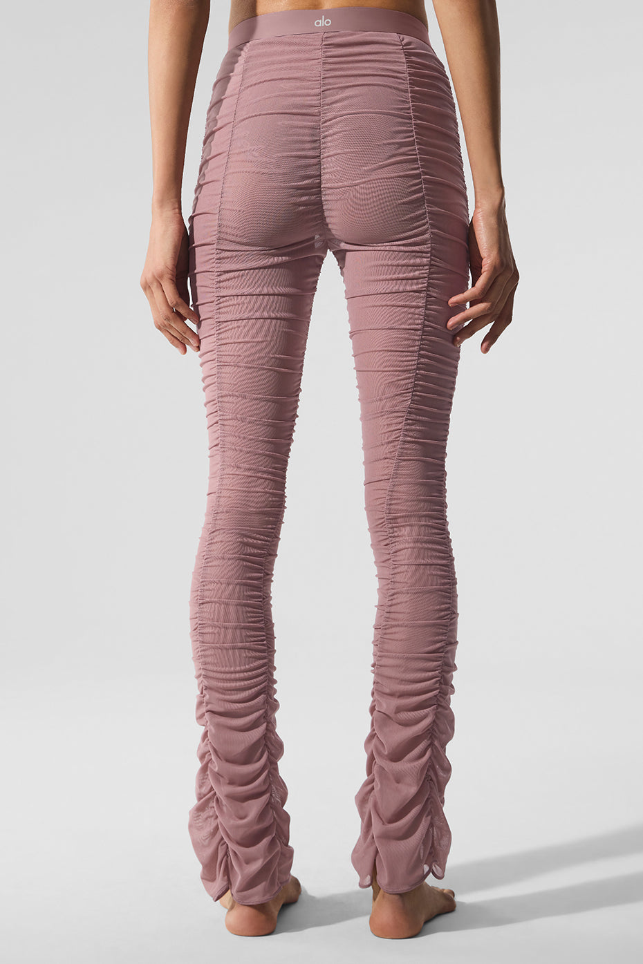 Smoky Quartz high-waisted leggings paired with matching top in a yoga studio.