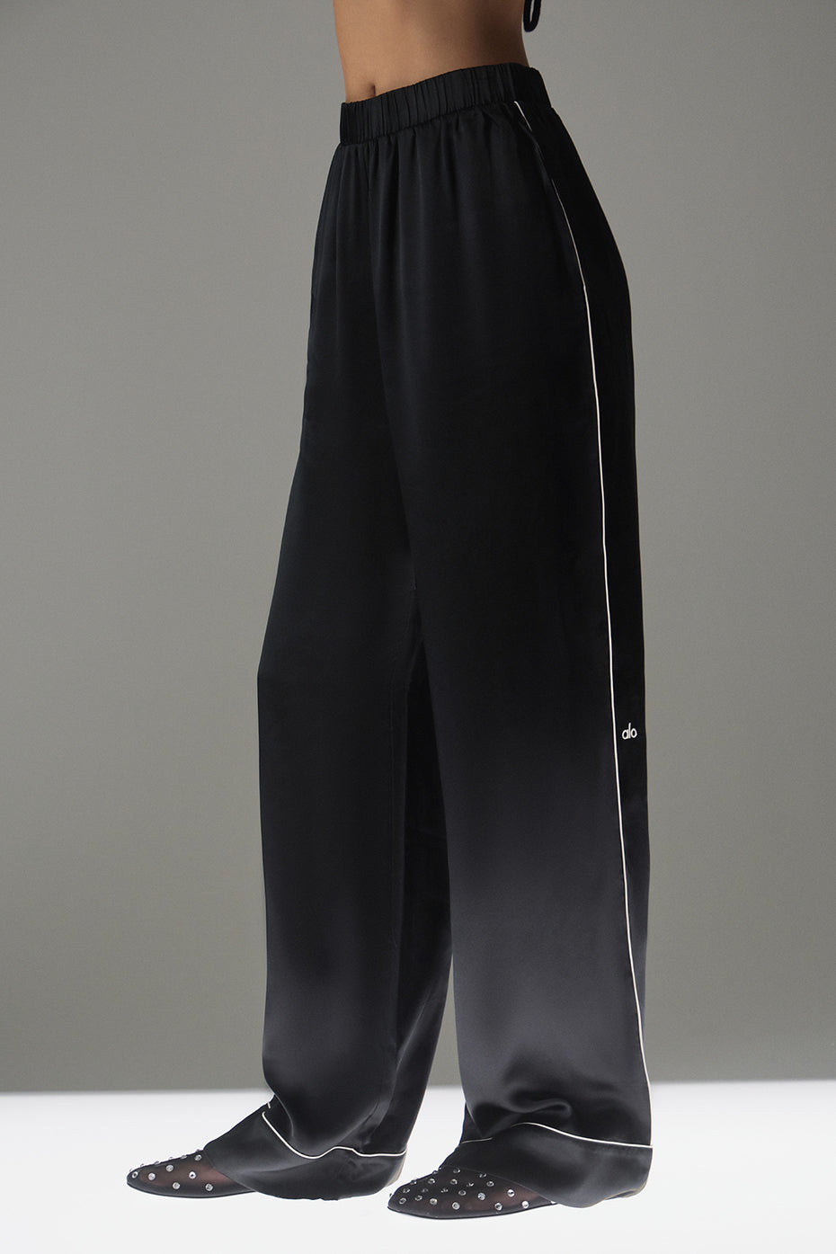 Front view of Courchevel black silk pants showcasing relaxed fit.