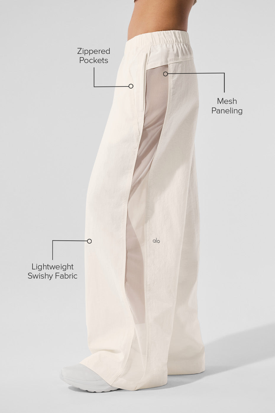 Side view showcasing the mesh paneling of the wide leg yoga pants.