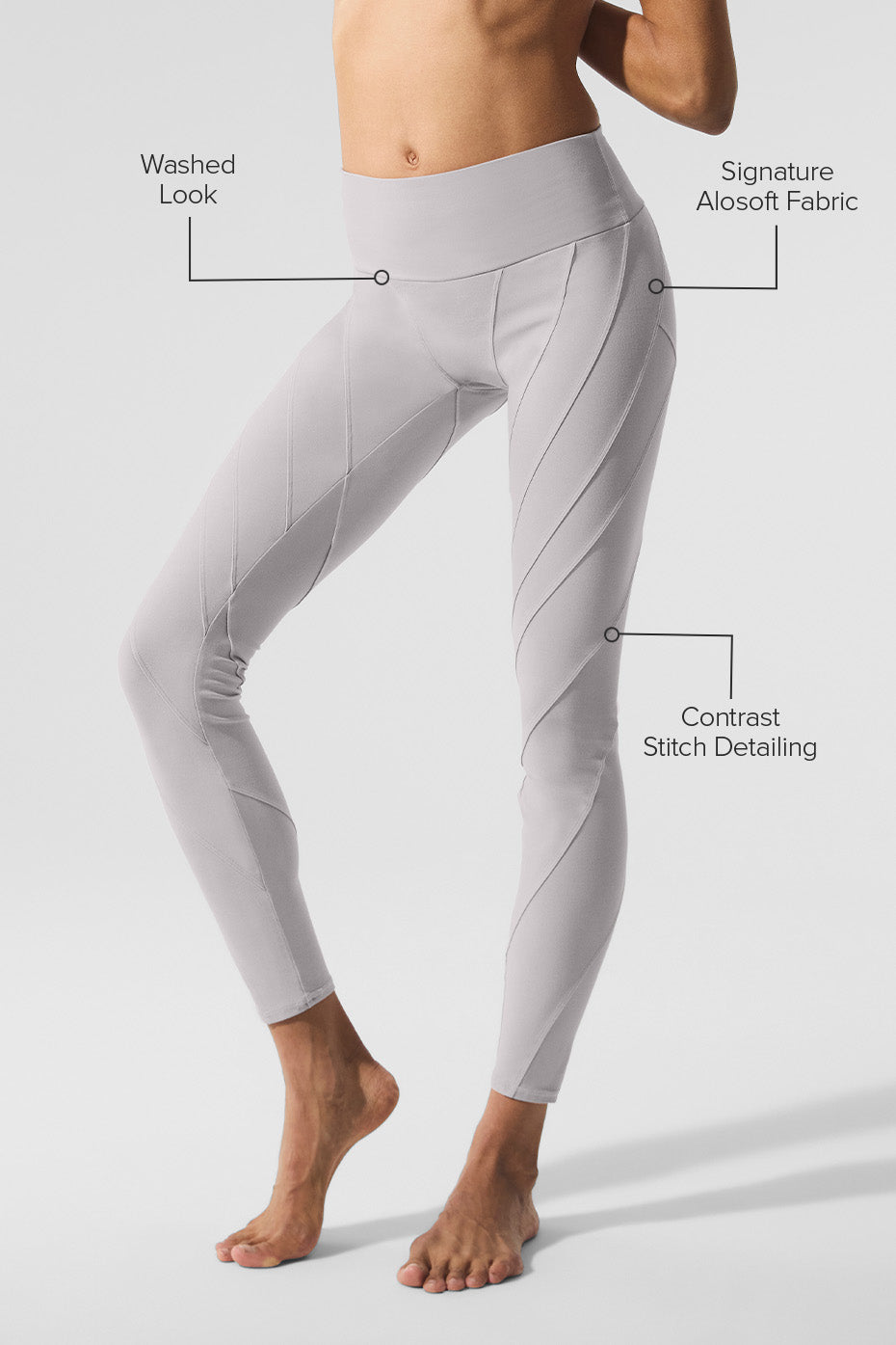 Model doing yoga in grey wide-leg yoga pants under sunlight