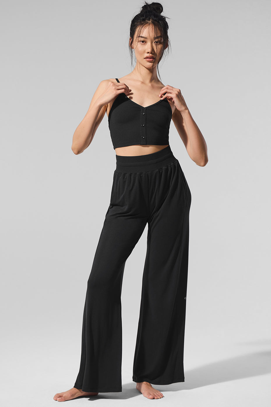 Model wearing Elation Ultra High Rise Flare Lounge Pants paired with a tank top.