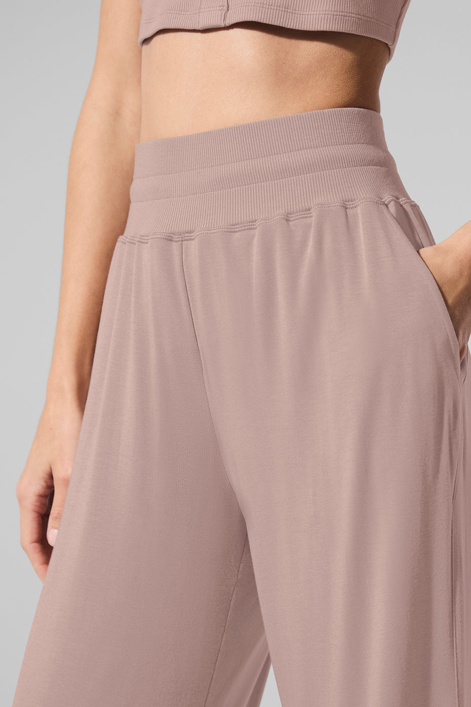 Side view of semi-sheer lounge pants, highlighting the flowy silhouette.