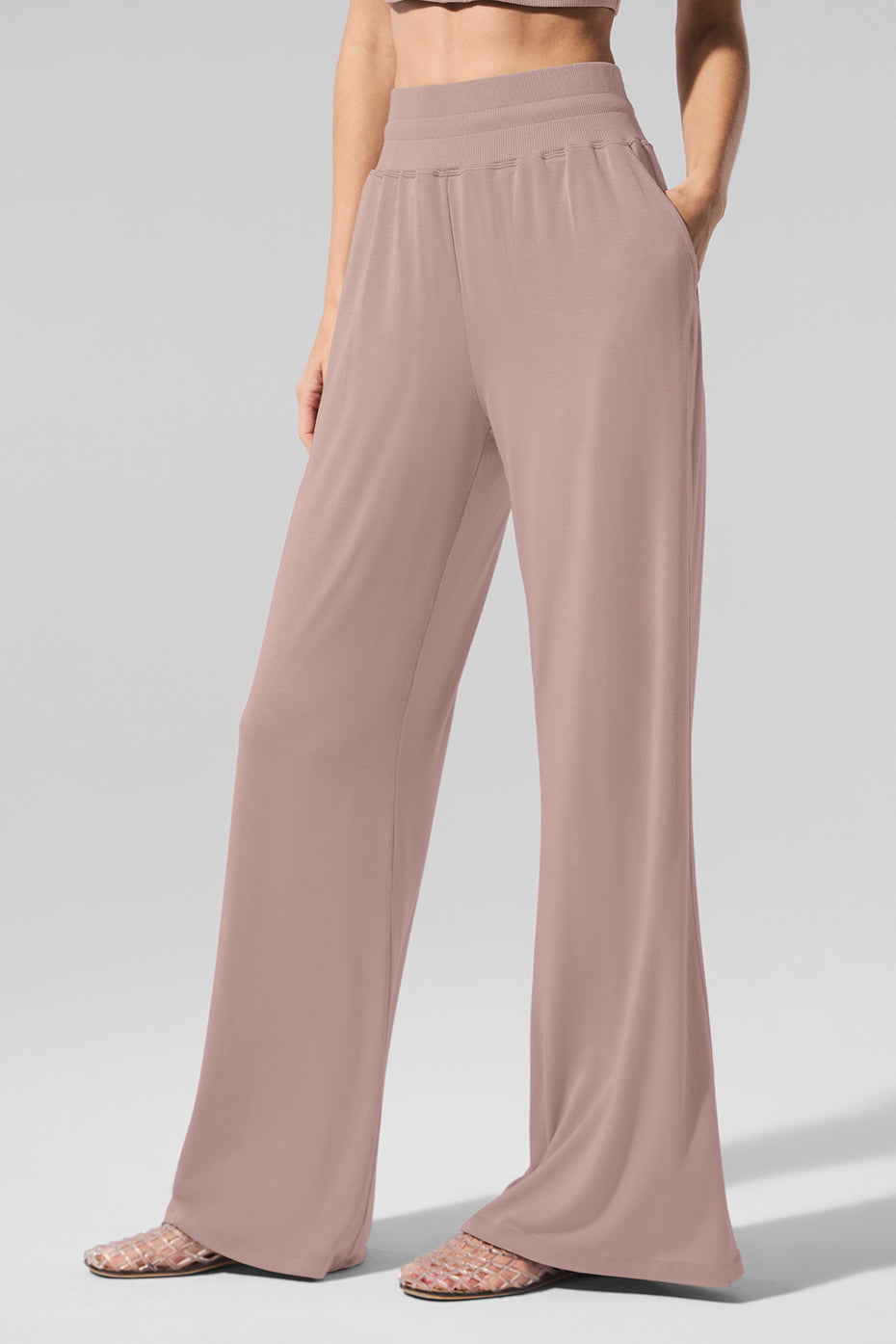 Side view of semi-sheer lounge pants, highlighting the flowy silhouette.