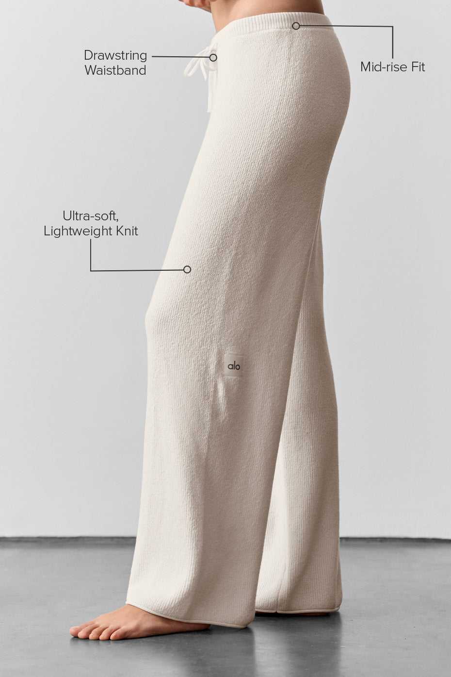 Model wearing lightweight summer pants paired with a tank top