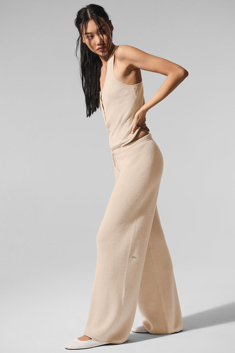 Mid-rise beach loungewear pants styled with sandals and cotton tank