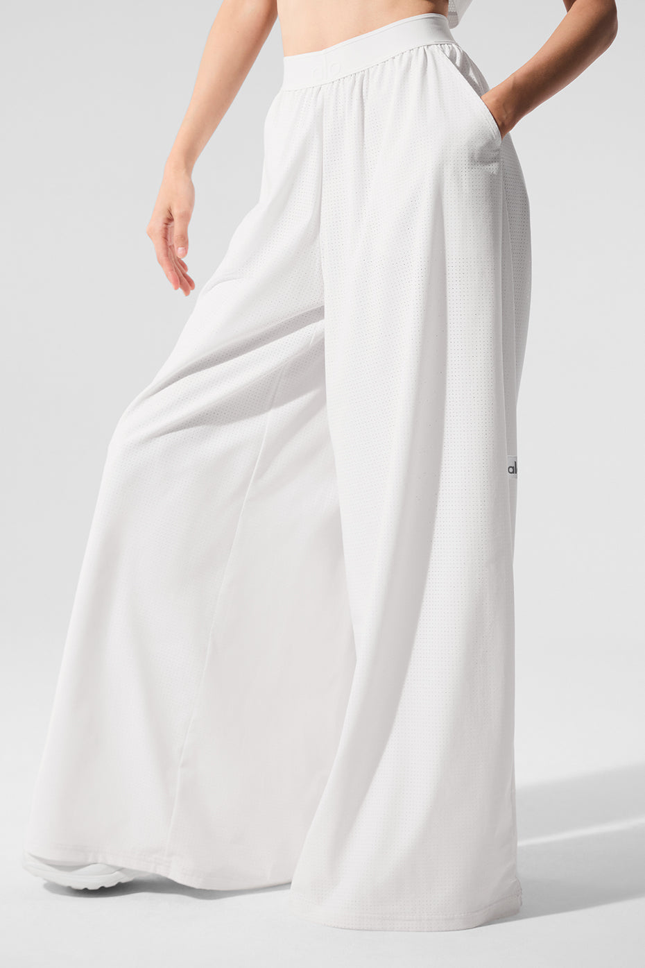 Chic mesh trousers styled for a sunny day out.