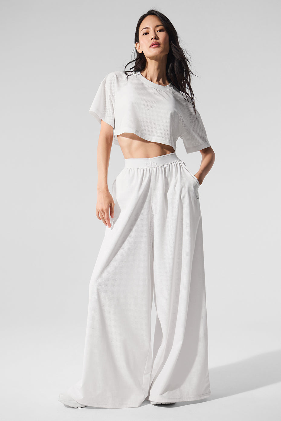 Chic mesh trousers styled for a sunny day out.