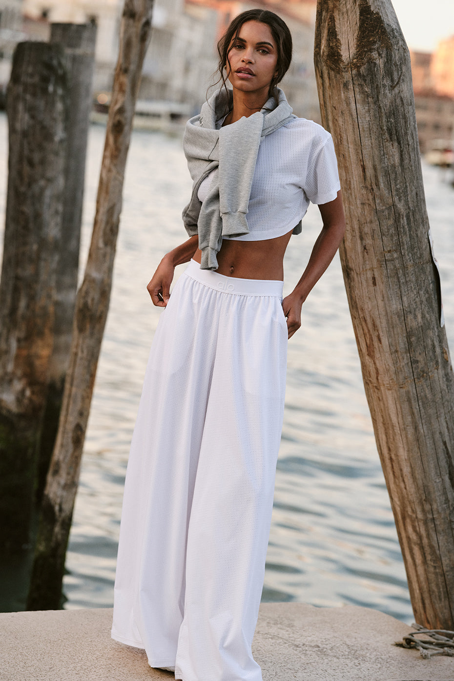 Breezy mesh trousers in white, ideal for summer travel.