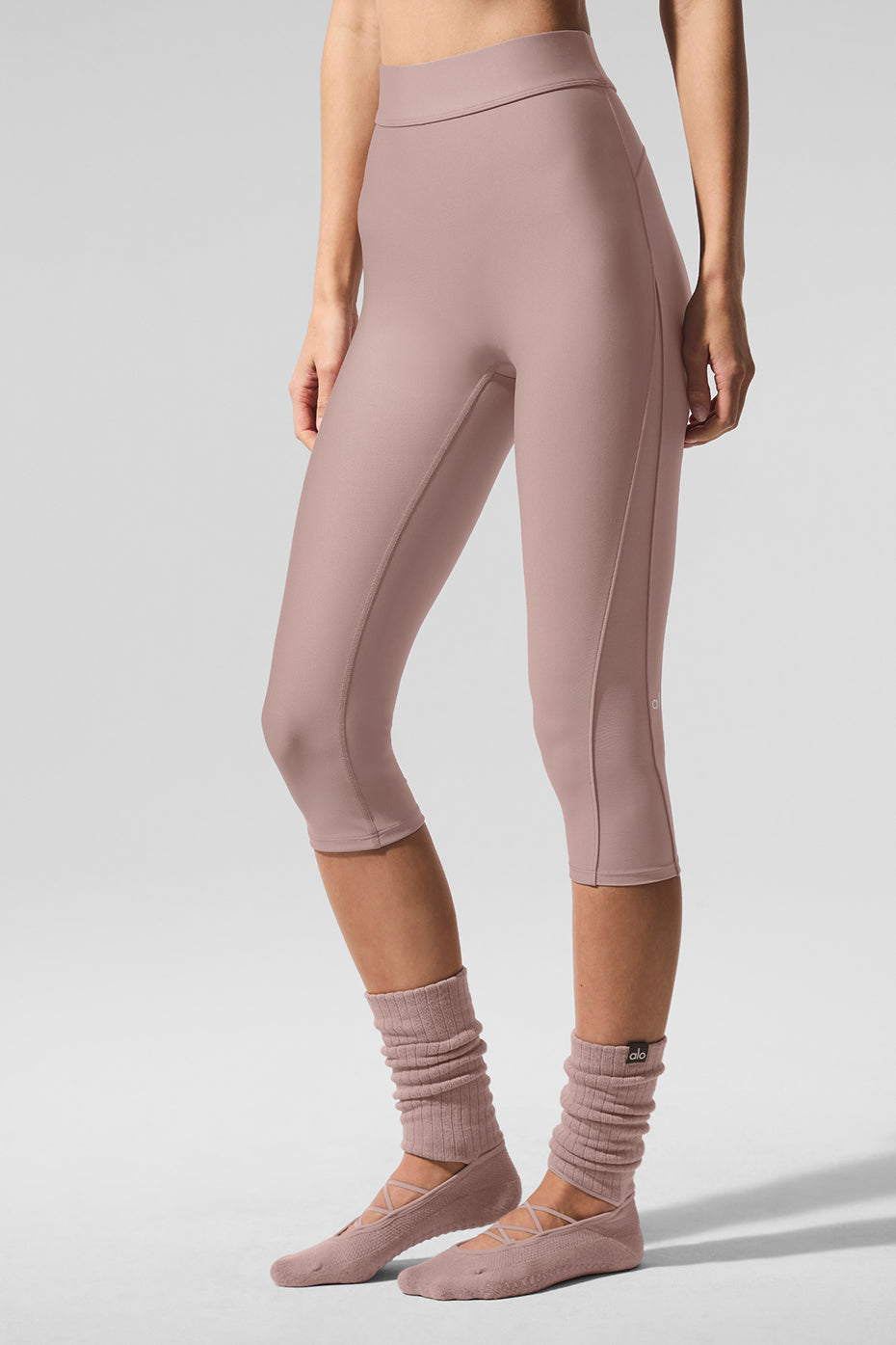 Side view showcasing breathable mesh panels of the high-waist capris.