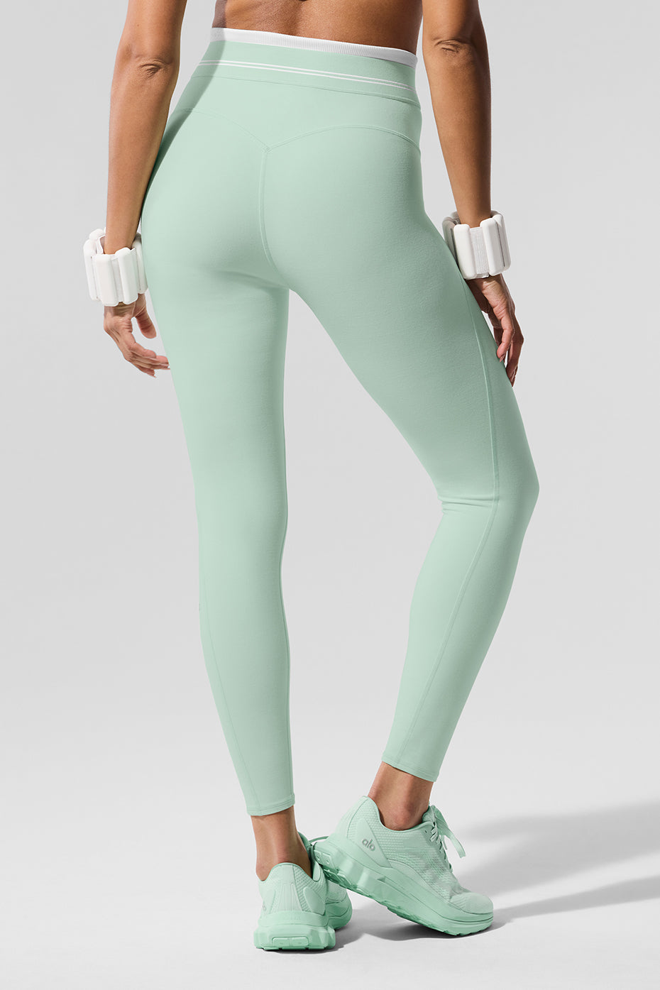 Close-up of the elastic logo waistband on the leggings