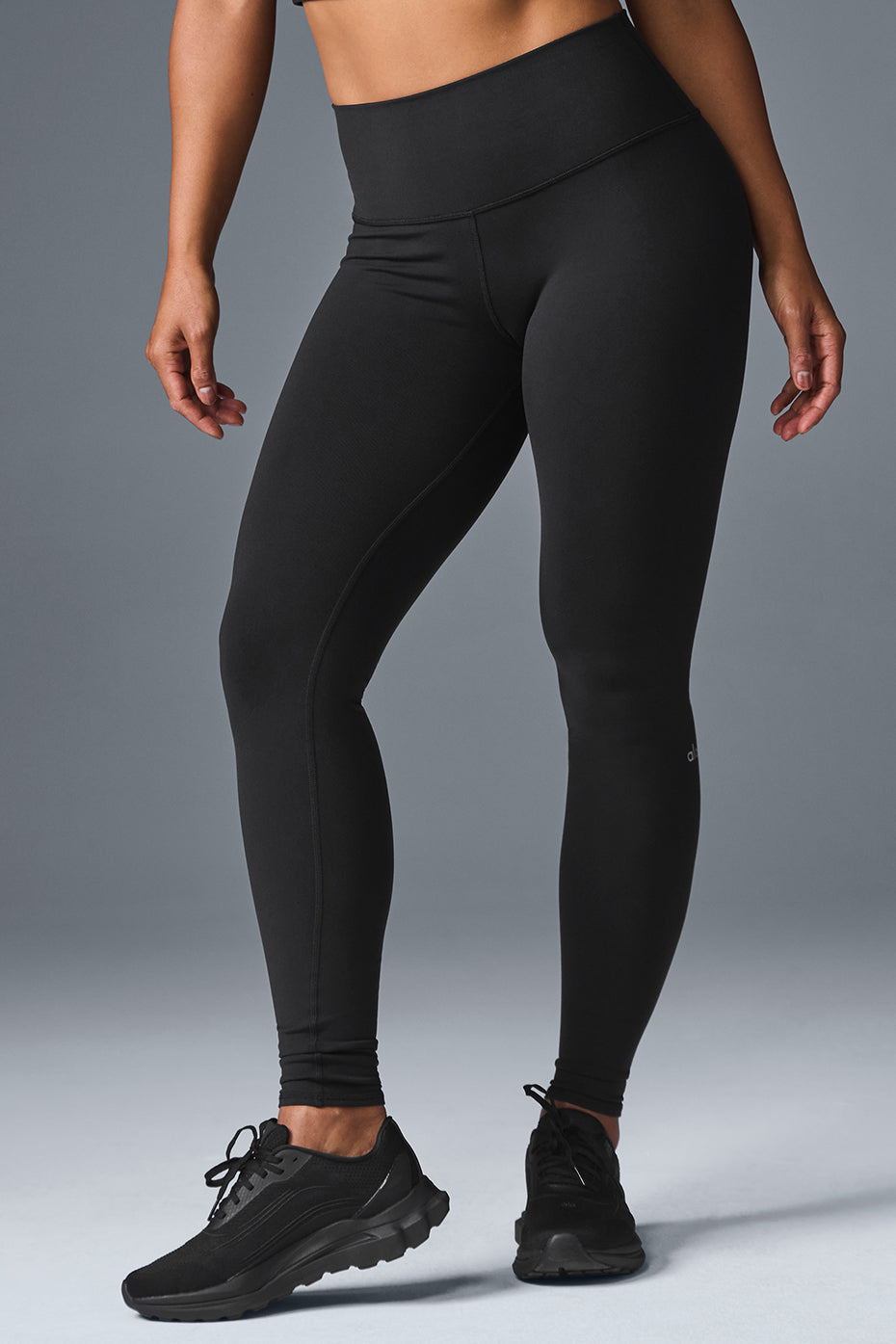 High waist leggings on a woman during a Pilates session, showcasing the sculpting fit