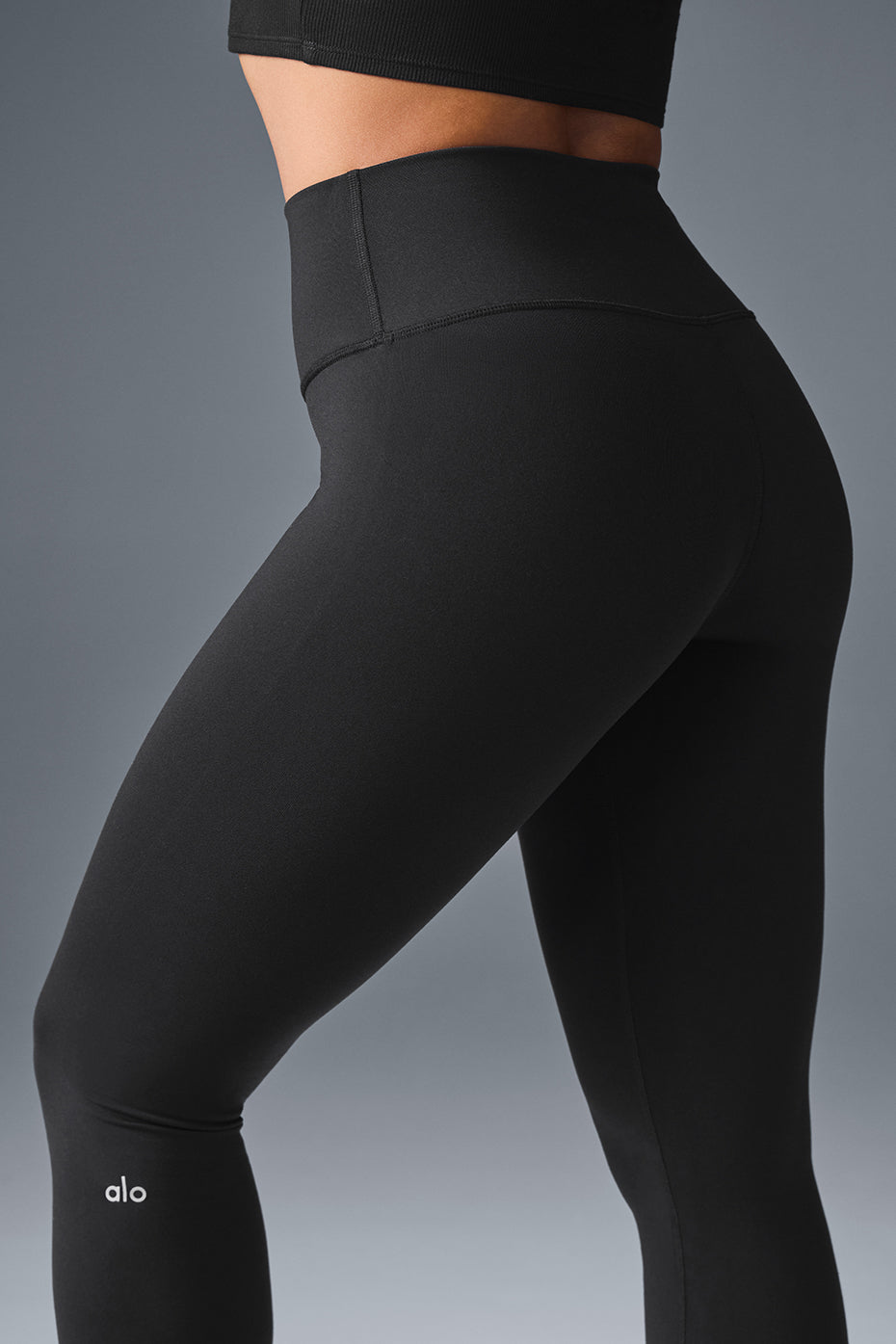 Layering high waisted straight leg jeans over the leggings for a transitional outfit