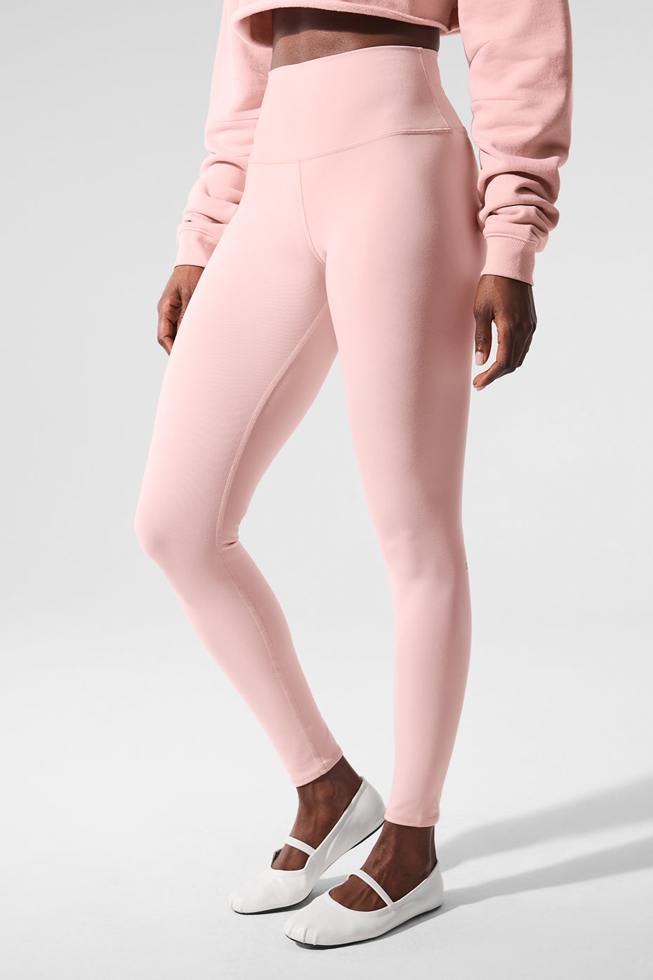 Back view highlighting the high-rise waistband of the leggings.