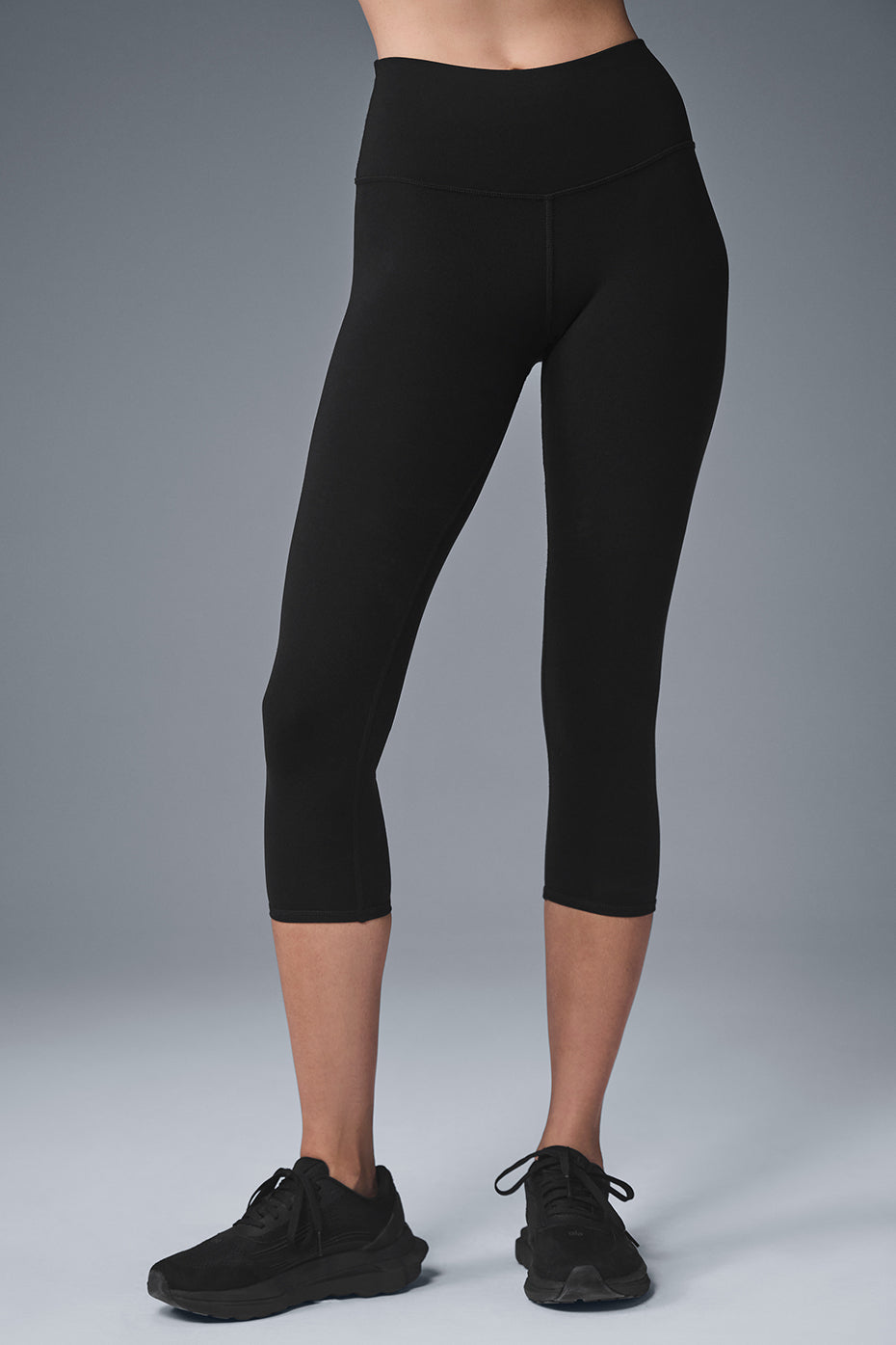 Front view of sculpting high waist capri leggings in black