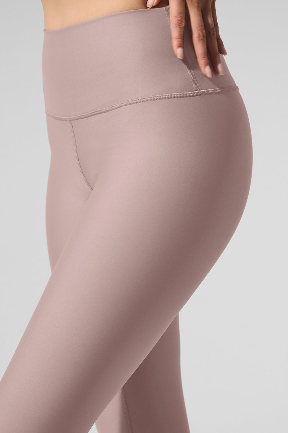Close-up of compression leggings fabric texture and stitching