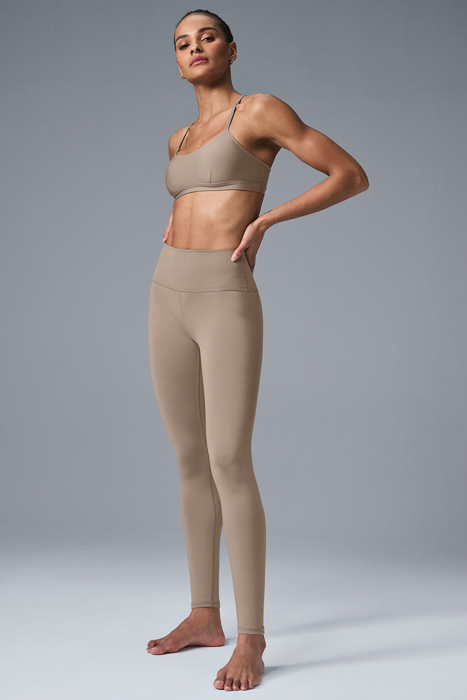 Side view of supportive compression leggings for women during yoga