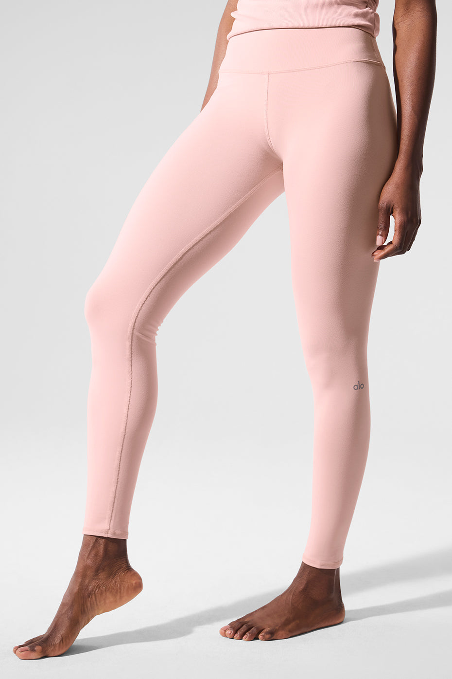 Front view of cropped high-waist leggings in Pink Quartz, ideal for light training