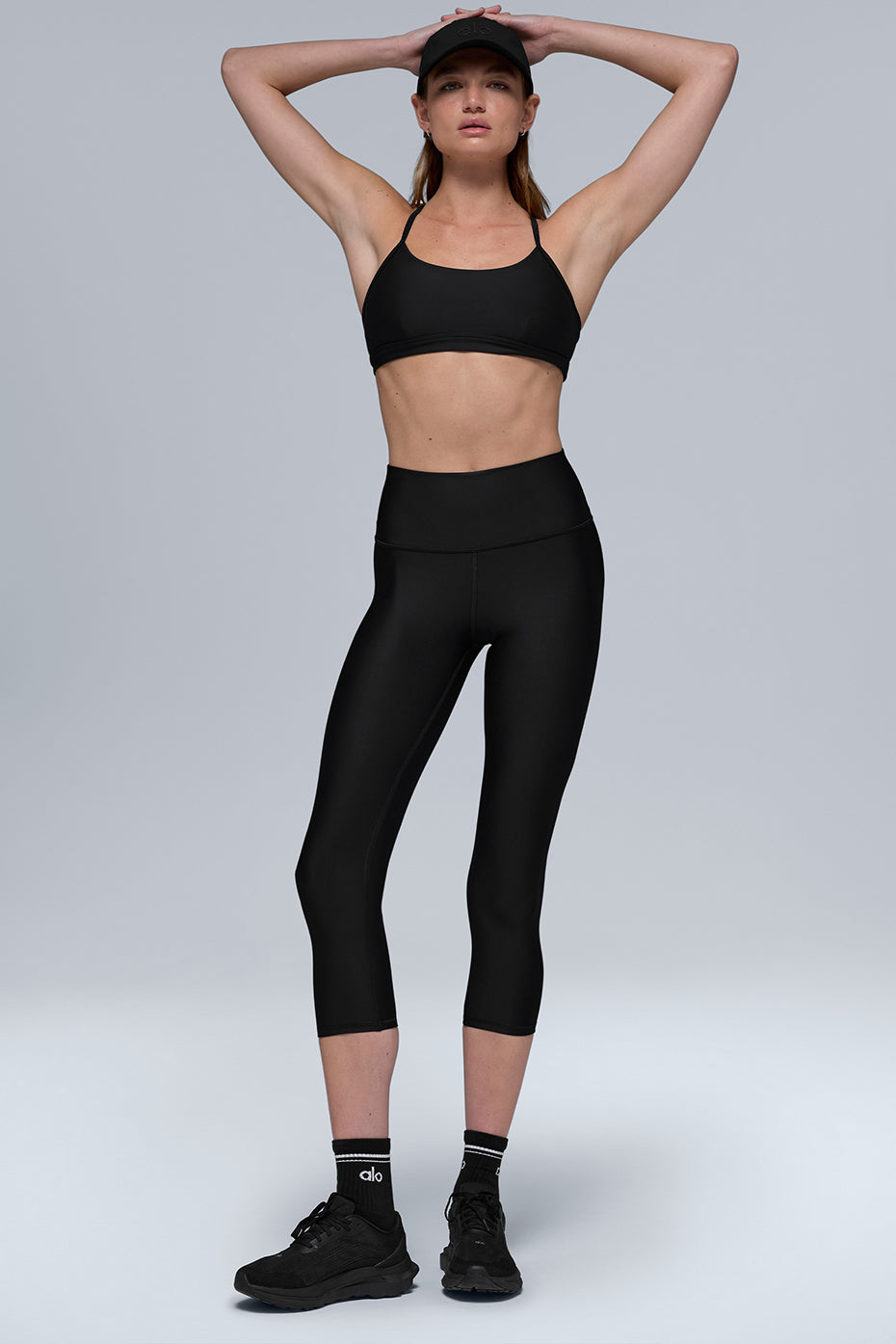 Side view of black Airlift Capri showing sculpting waist and stretch fit