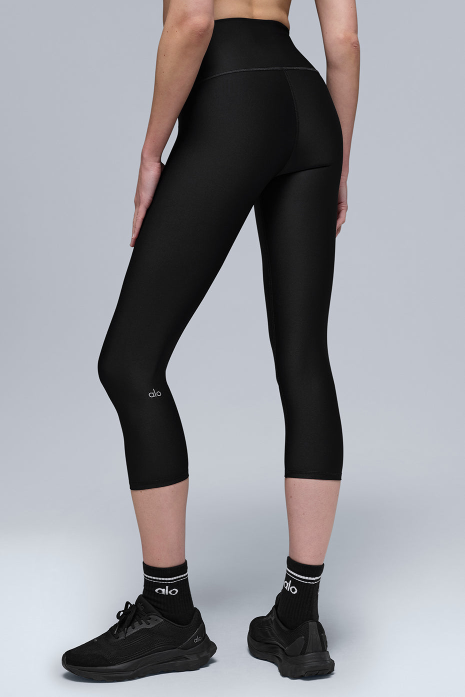 Black capris styled with cropped top, perfect for warm weather workouts