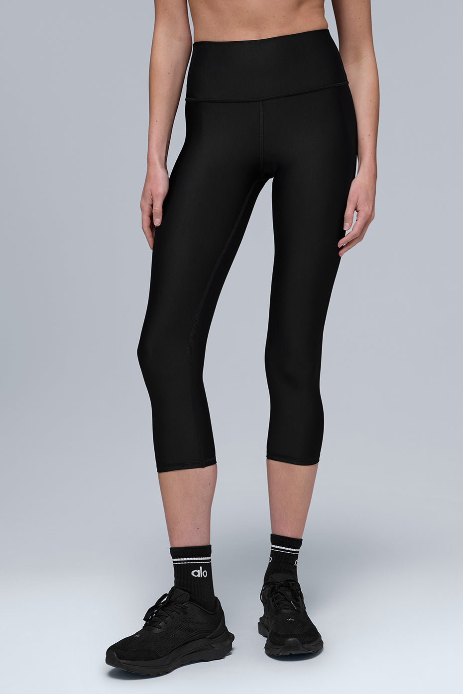 Close-up of Airlift fabric texture on black high waist capri pants