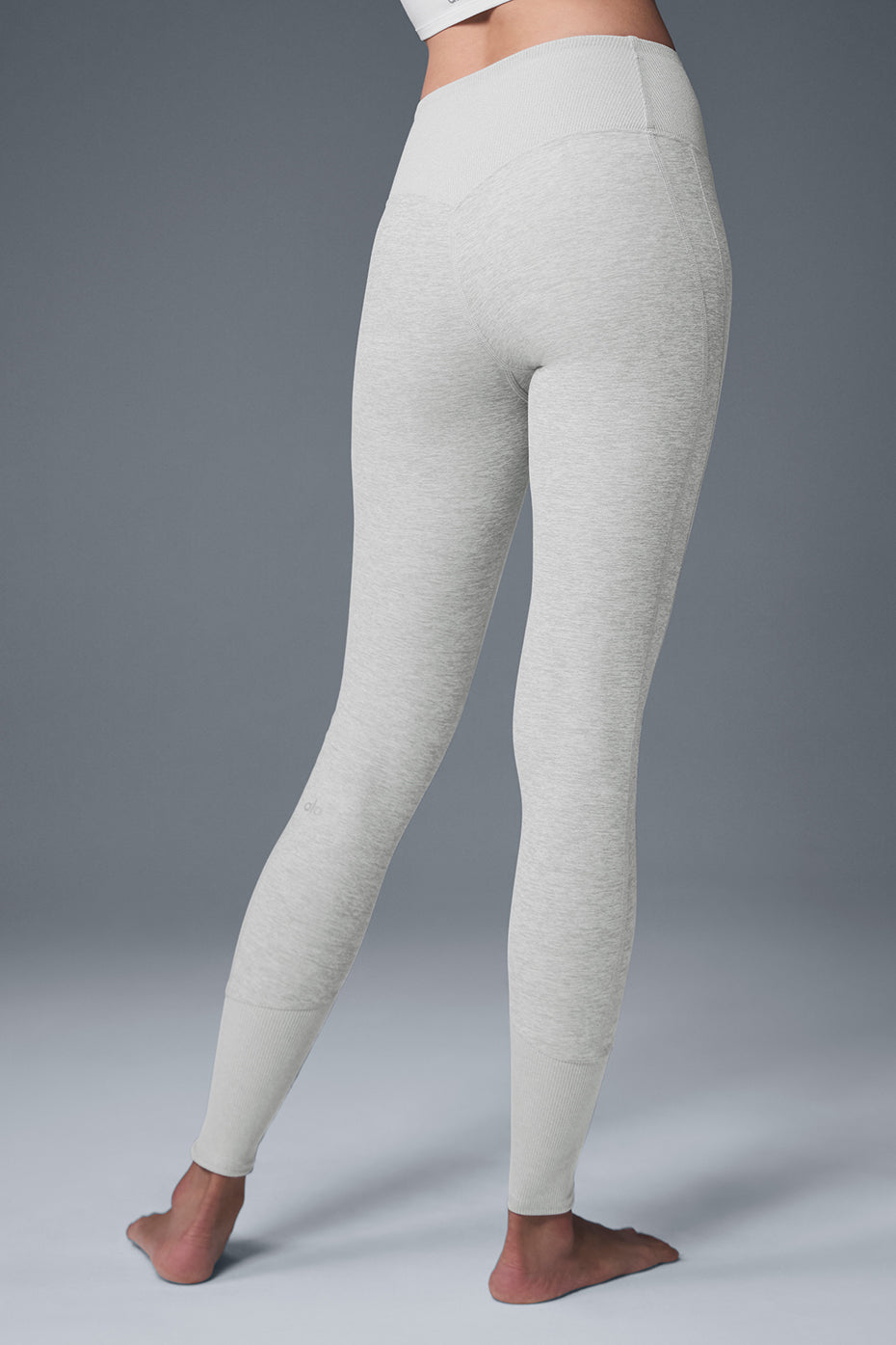 Side view of Alosoft high waist leggings, highlighting the contouring back seam.