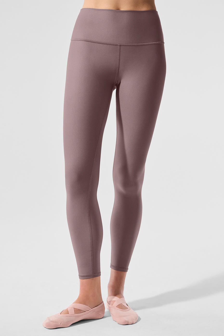 Side angle of model wearing mushroom 7/8 leggings outdoors