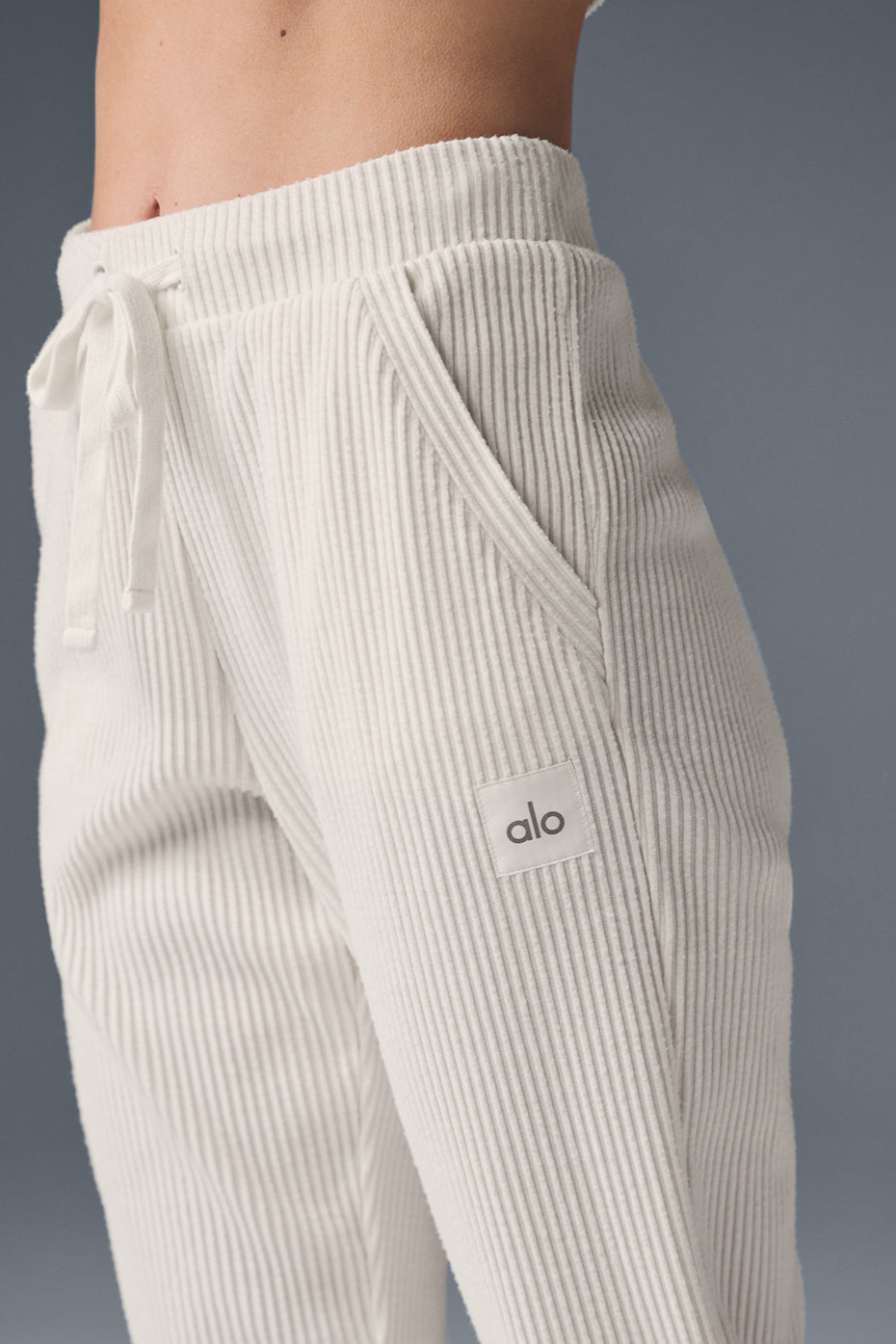 Model wearing Muse wide leg sweatpants, styled with a matching hoodie.