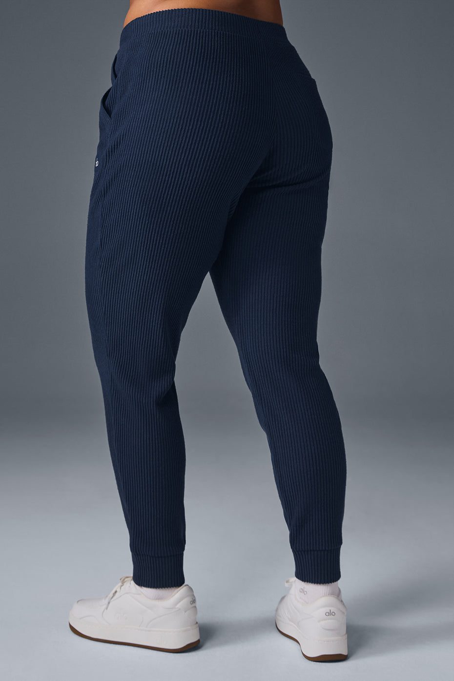 Close-up of wide-ribbed fabric and high-rise waistband detail