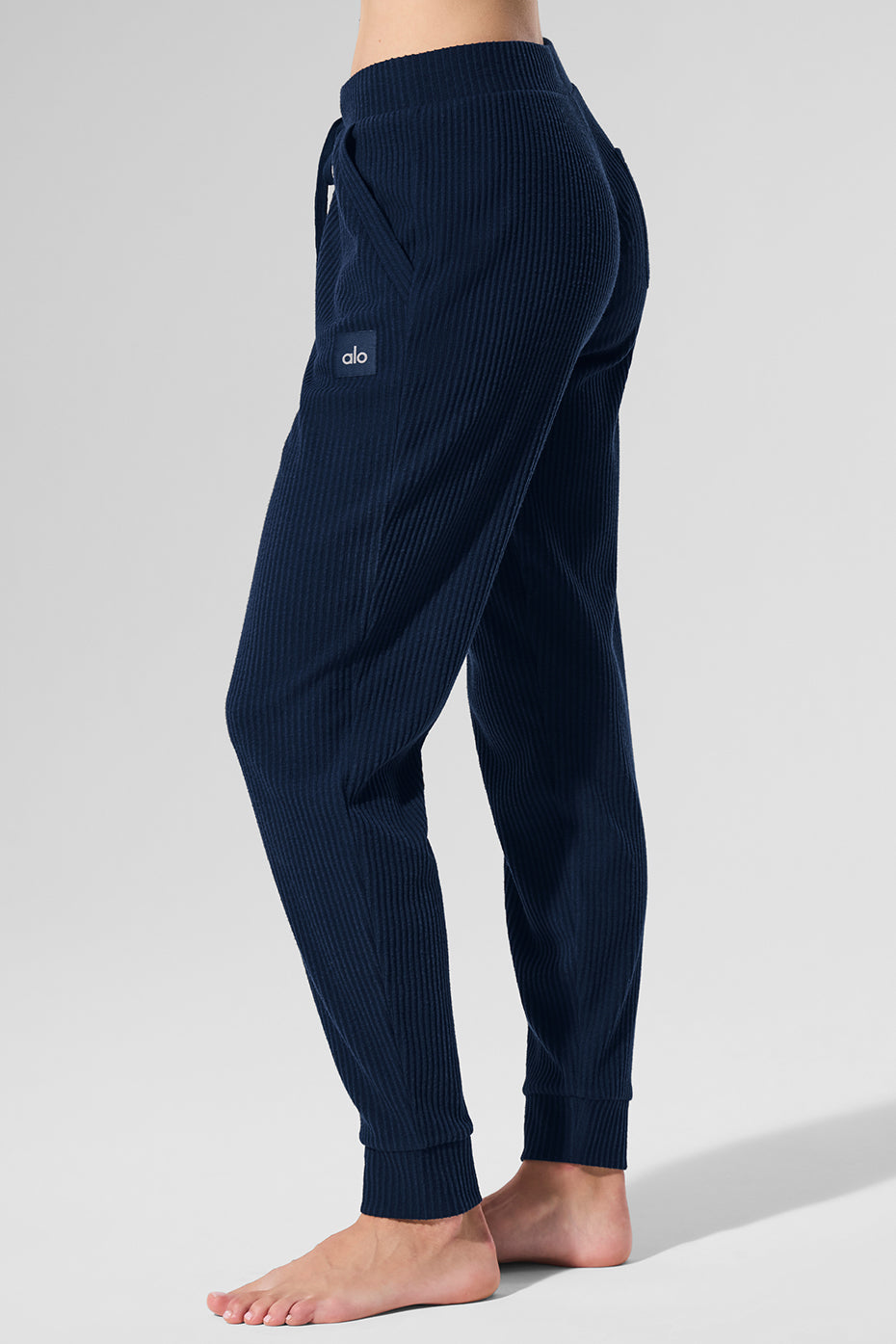 Close-up of wide-ribbed fabric and high-rise waistband detail