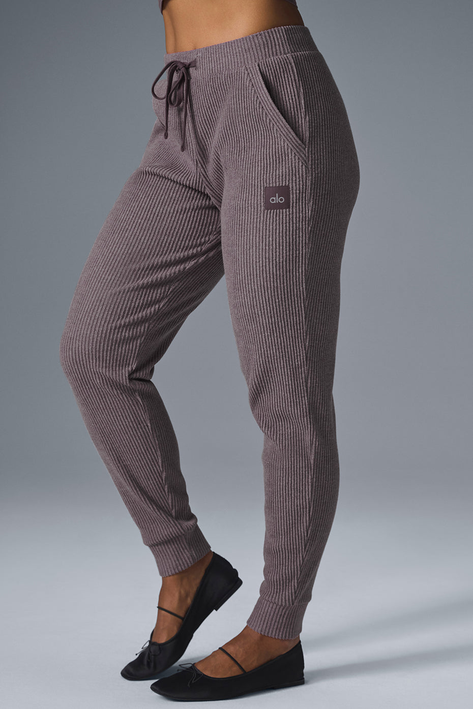 Back angle of sweatpants as loungewear, paired with casual hoodie.
