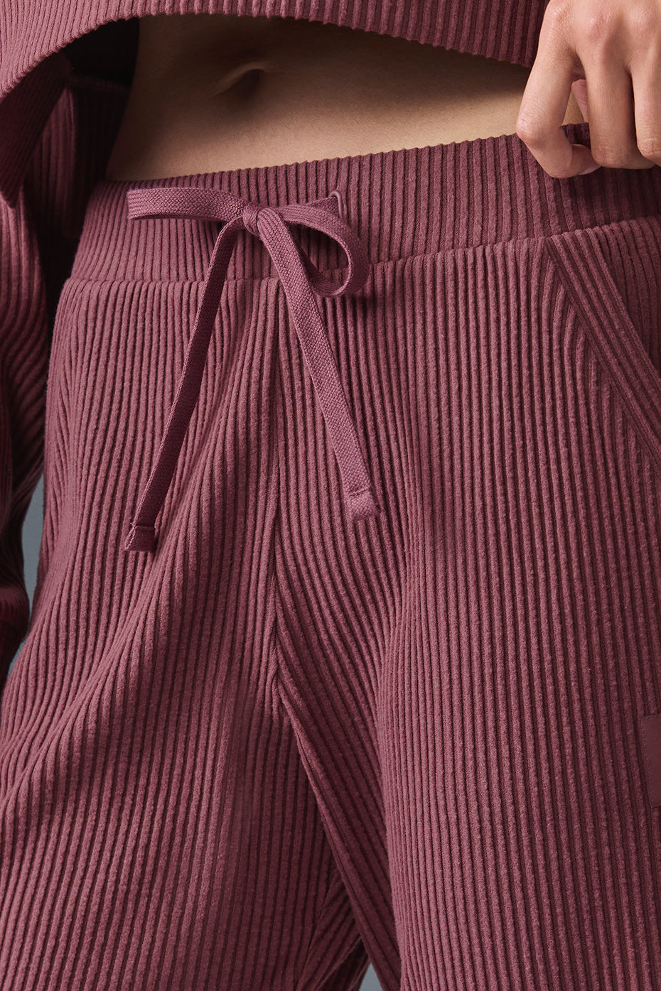 Side view of the Muse Sweatpants, highlighting the high-rise waistband and ankle cuffs.